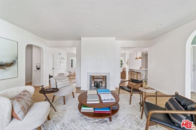 Luxury California real estate house with modern design, front yard, and trees.