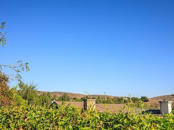 California real estate homes on hills with green trees and rooftops