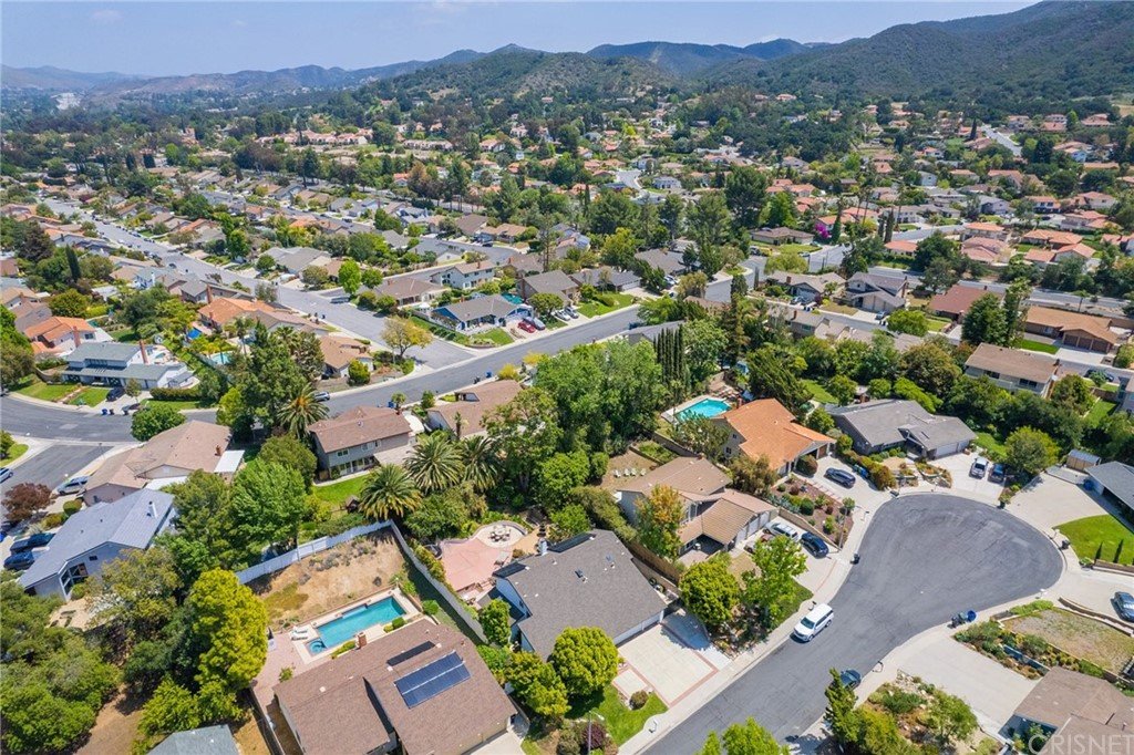 Aerial view of California real estate houses with streets and gardens. \