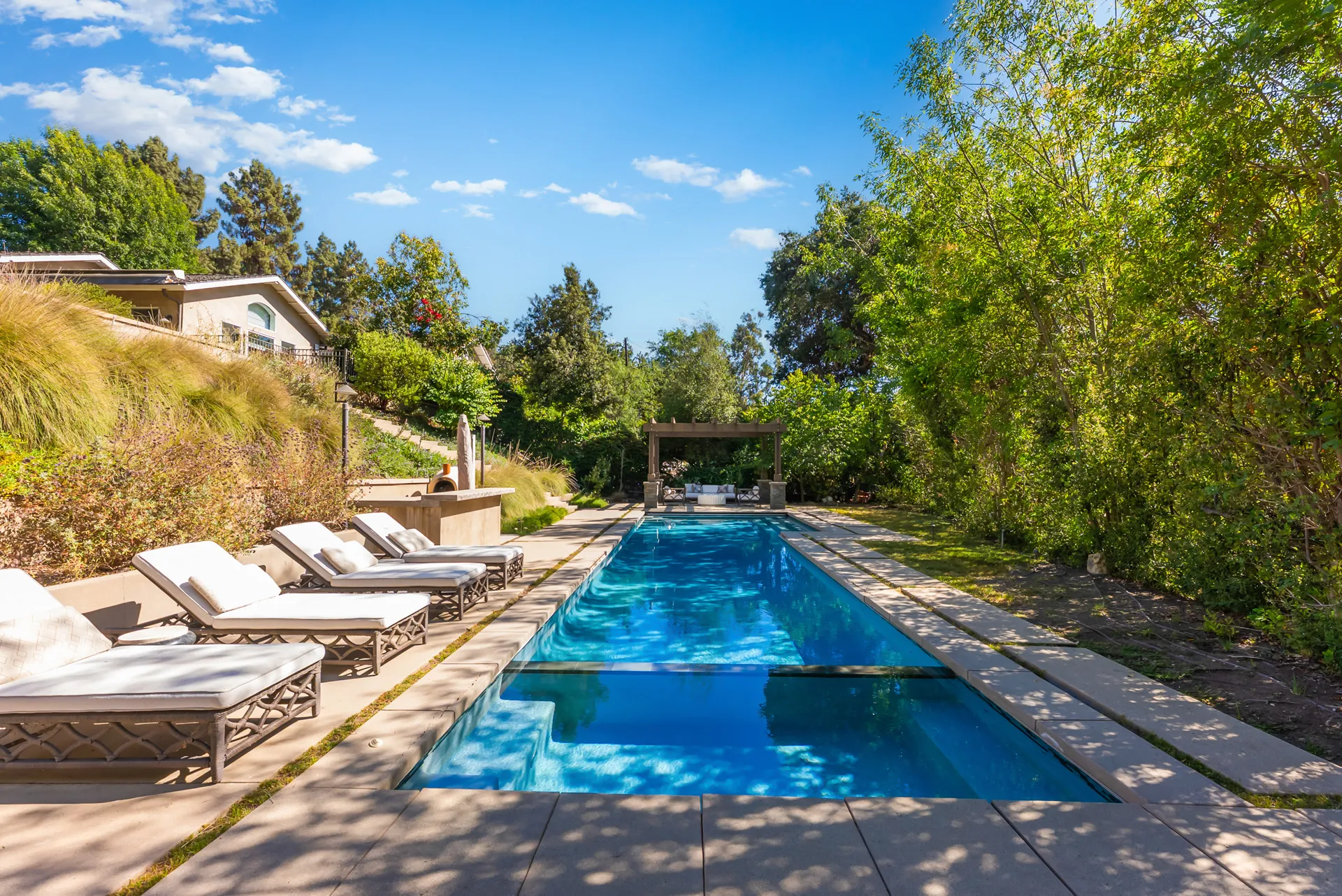 Pool long toward pergola